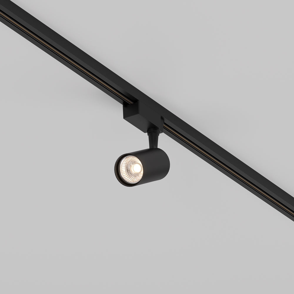 Version noire du spot orientable fixé sur rail, éclairage allumé en gros plan