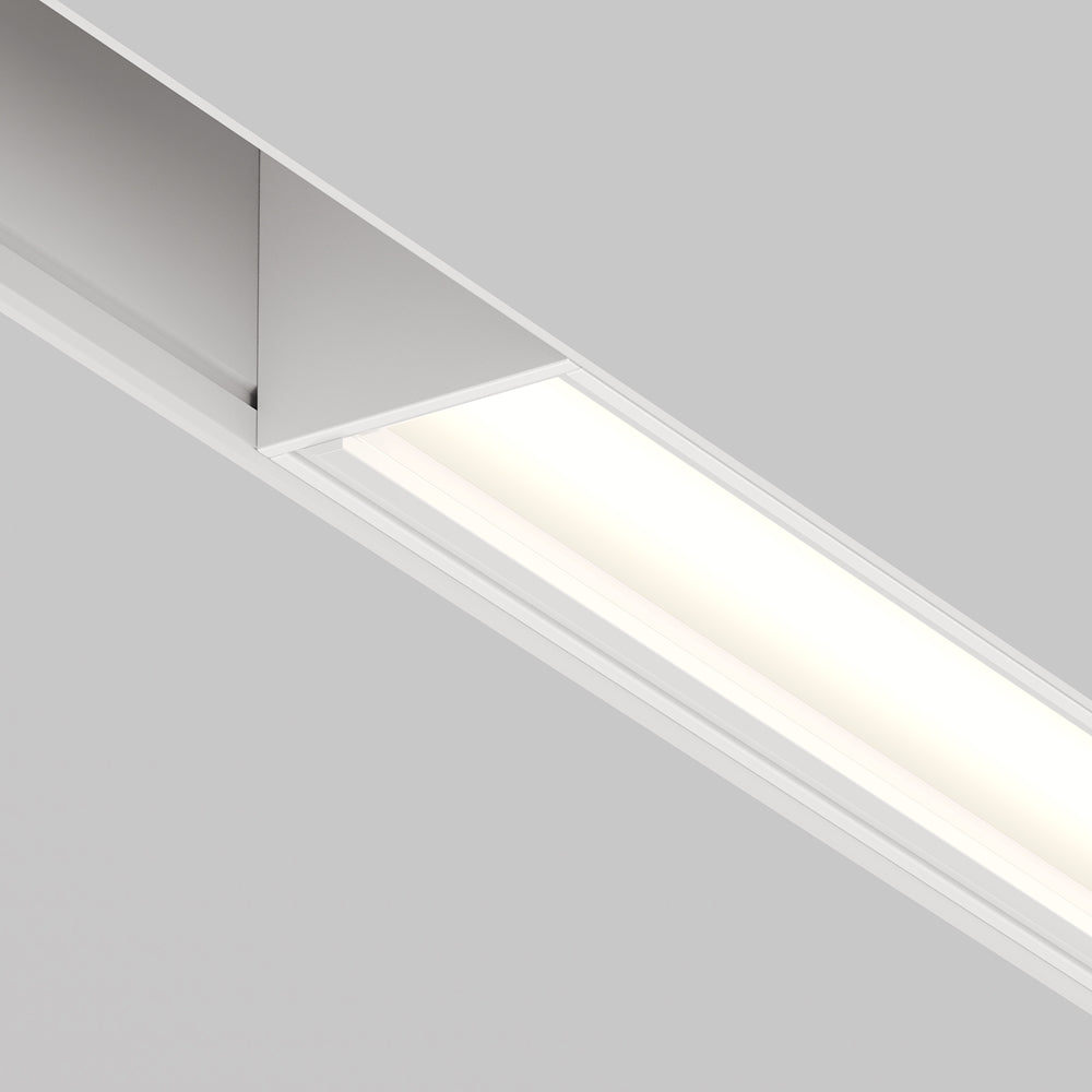 Vue rapprochée de l'extrémité du profil encastré et de sa lumière diffuse