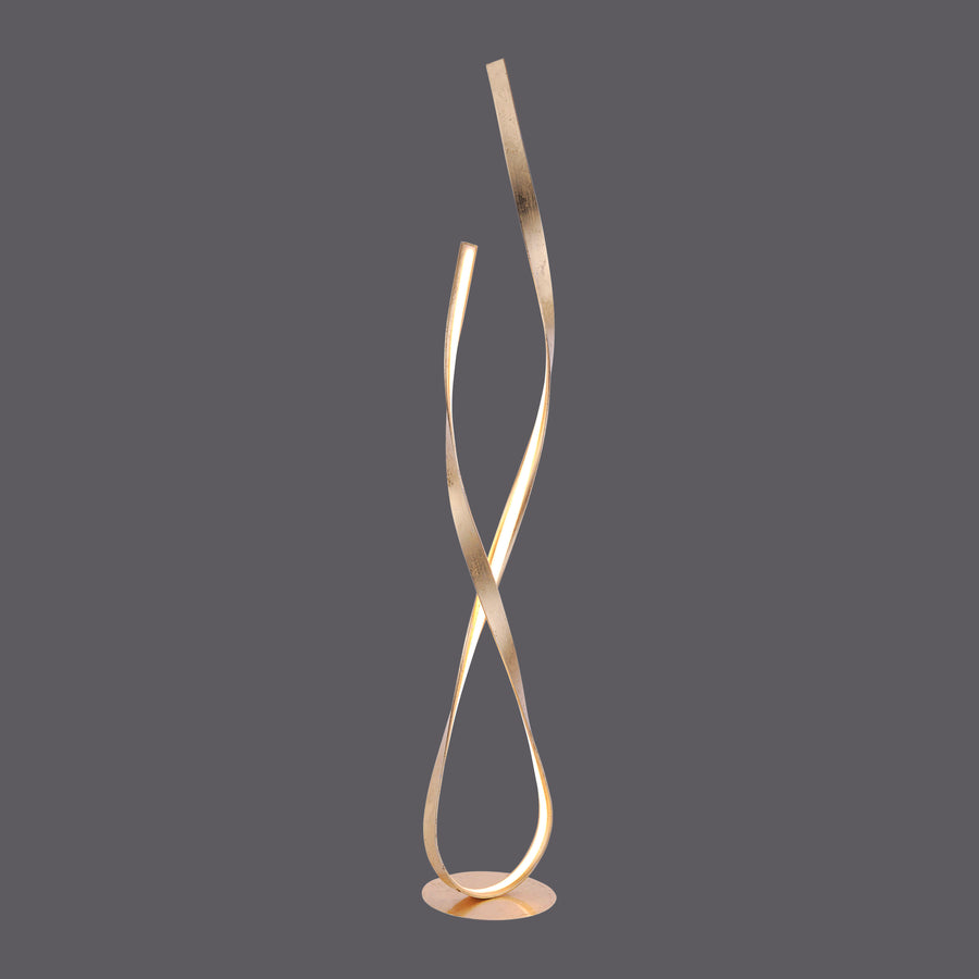 Lampadaire doré sculptural au design torsadé, présenté seul sur fond gris.