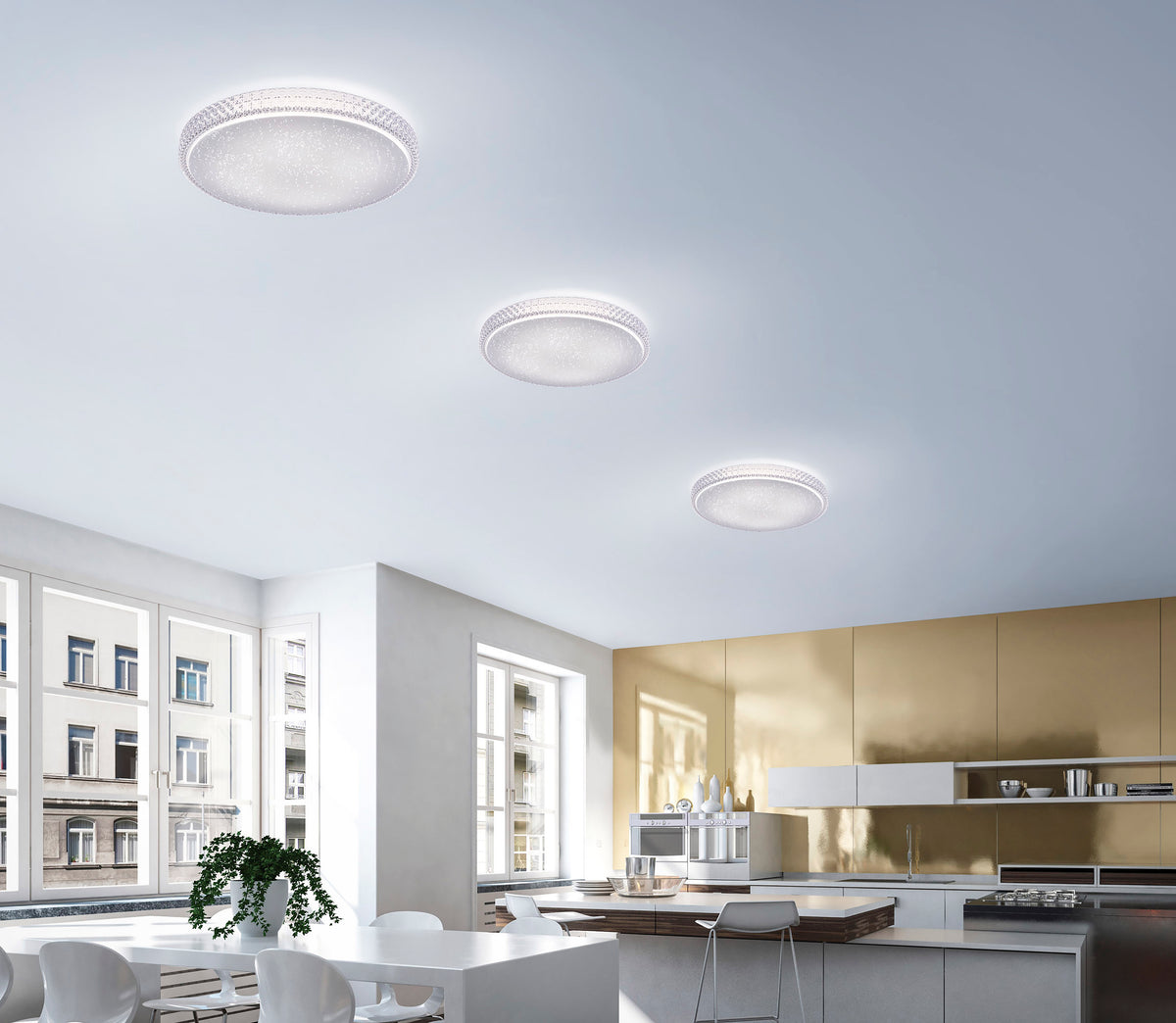 Mise en ambiance dans une cuisine moderne, trois plafonniers de tailles différentes au plafond