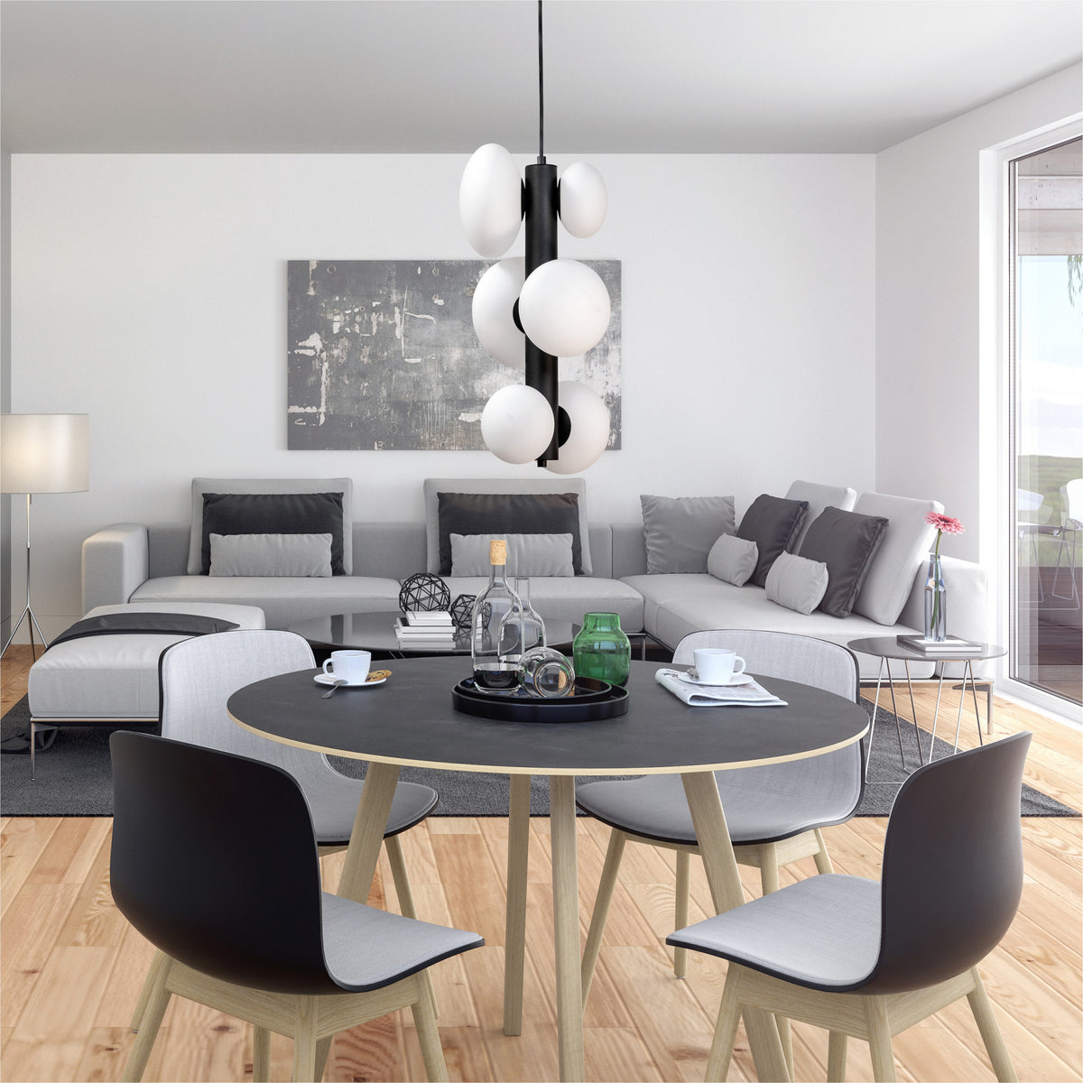 Suspension installée au-dessus d'une table à manger dans un salon contemporain