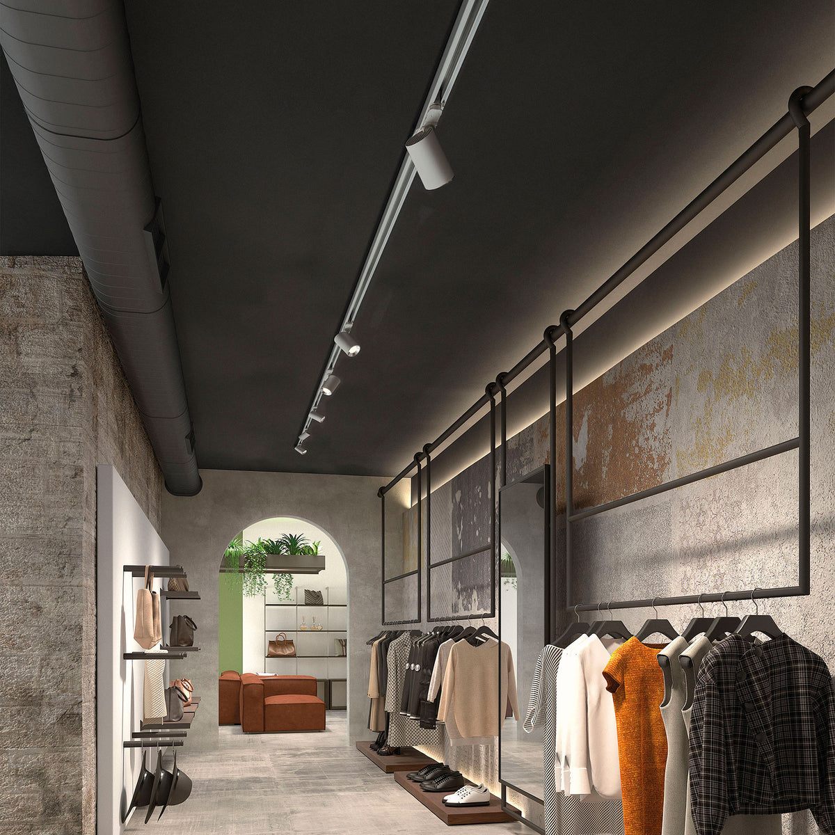 Rail de spots éclairant portants et présentoirs dans un magasin.