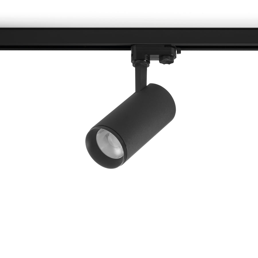 Version noire du spot sur rail, corps cylindrique et collerette orientable en détail.