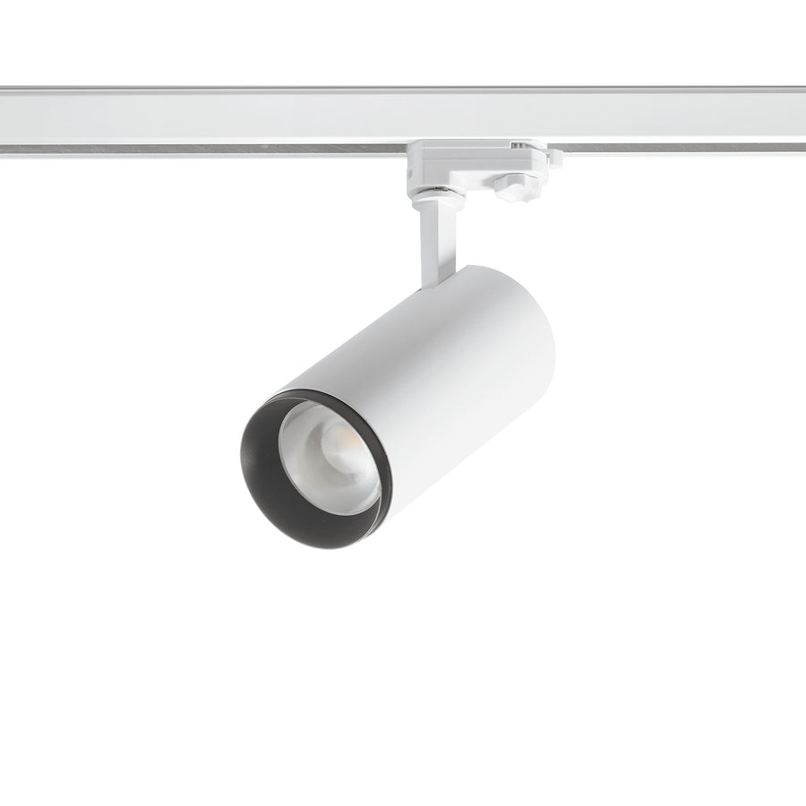 Spot blanc sur rail vu de trois quarts, corps cylindrique et lentille LED.