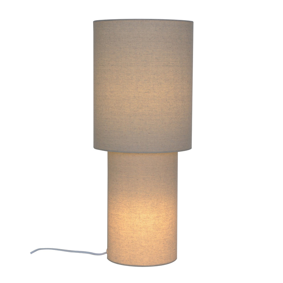 Lampadaire cylindrique beige en tissu, allumé, sur fond blanc, vue de face.
