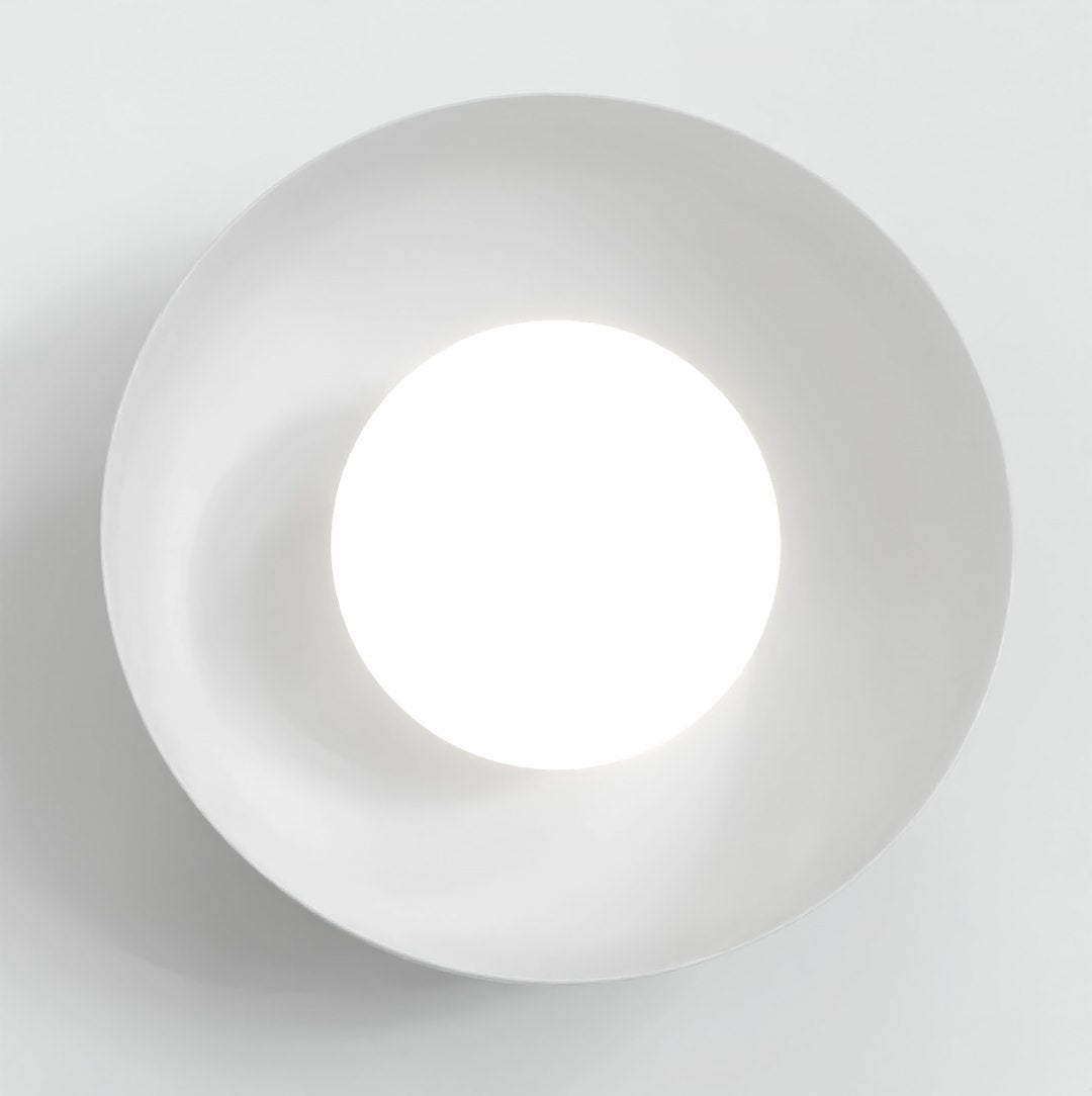 Face avant de l'applique montrant le diffuseur circulaire blanc et l'abat-jour rond
