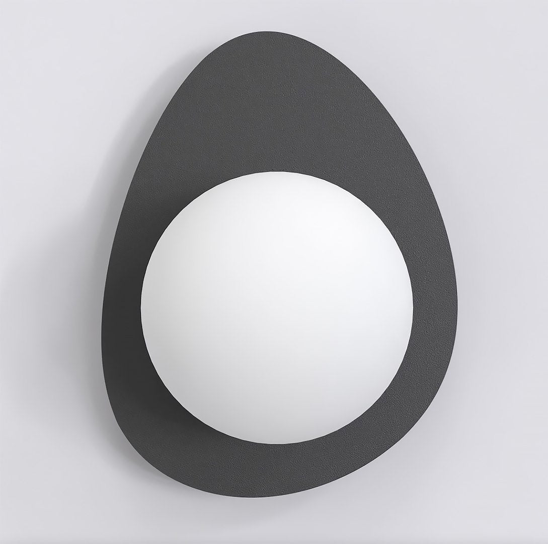 Vue de face montrant la platine ovale noire texturée et la sphère blanche centrée