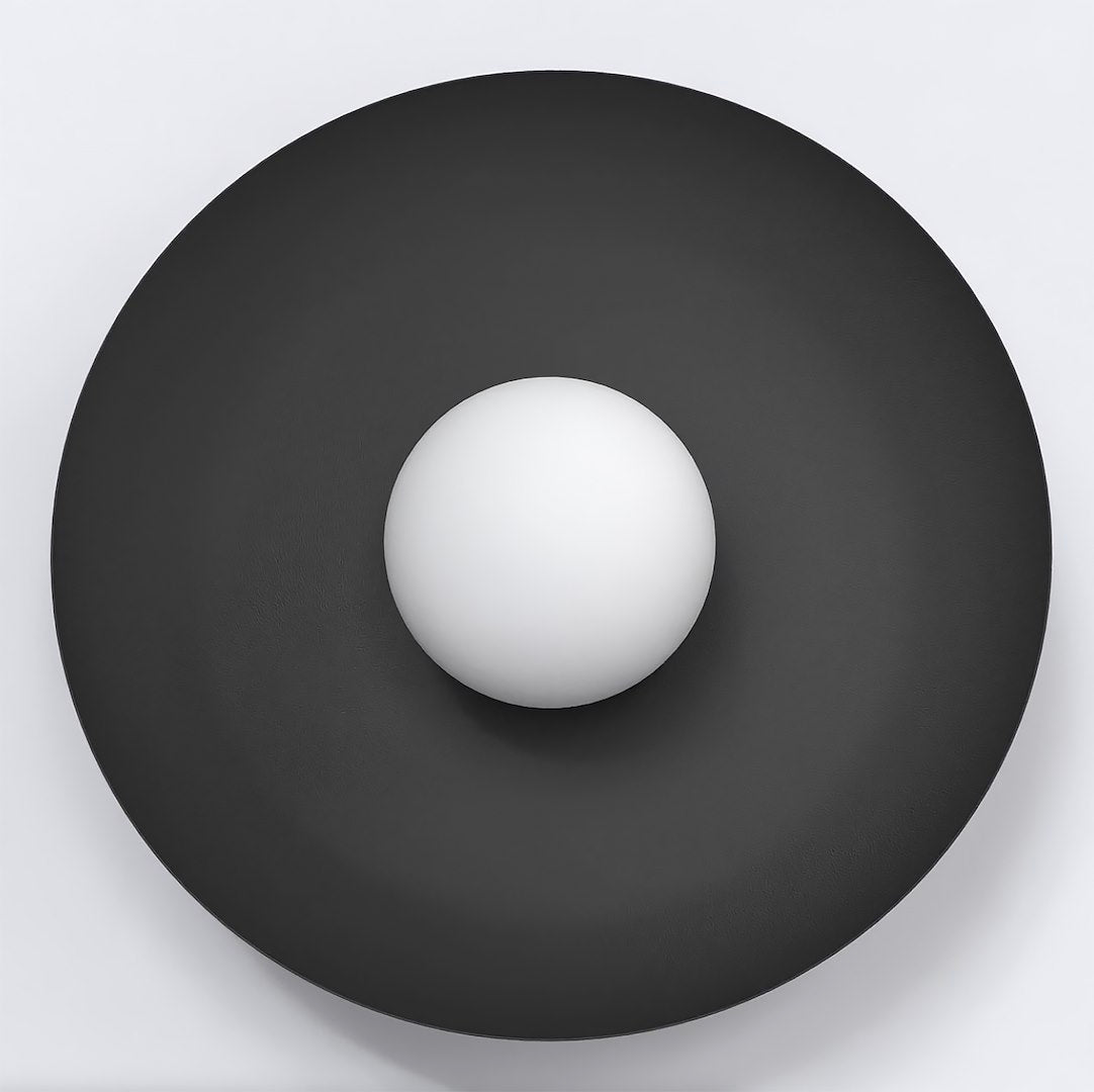 Vue de face de l'applique murale noire ronde avec sphère blanche centrale.