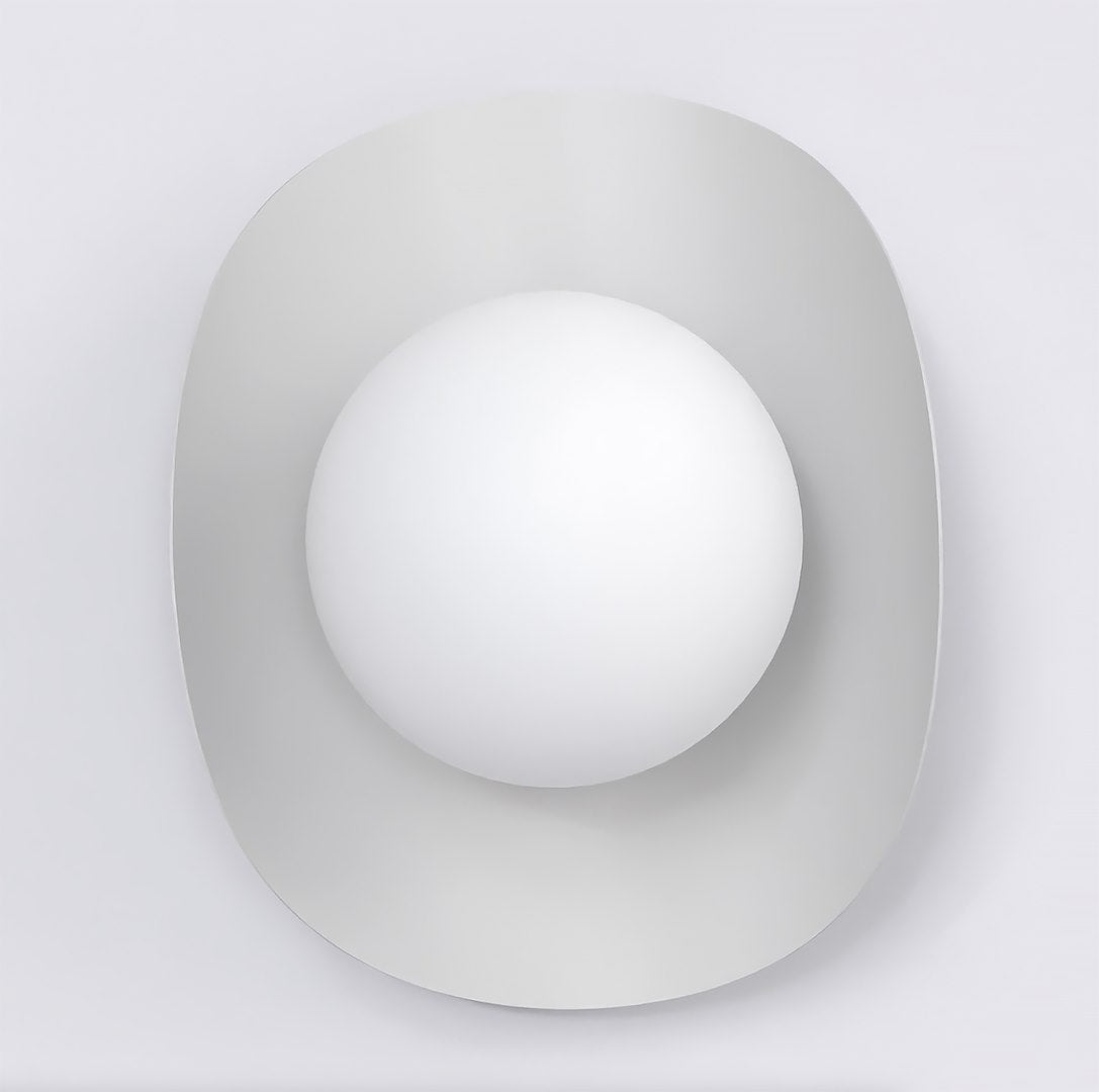 Vue de face montrant la platine arrondie et le diffuseur sphérique centré en verre opalin