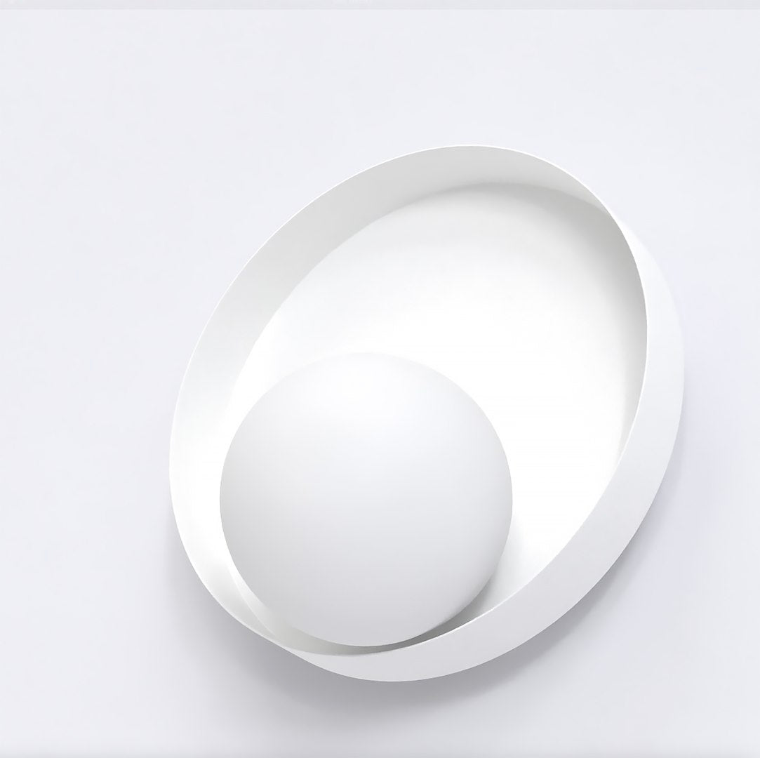 Vue de trois quarts rapprochée montrant la sphère blanche saillante sur le disque