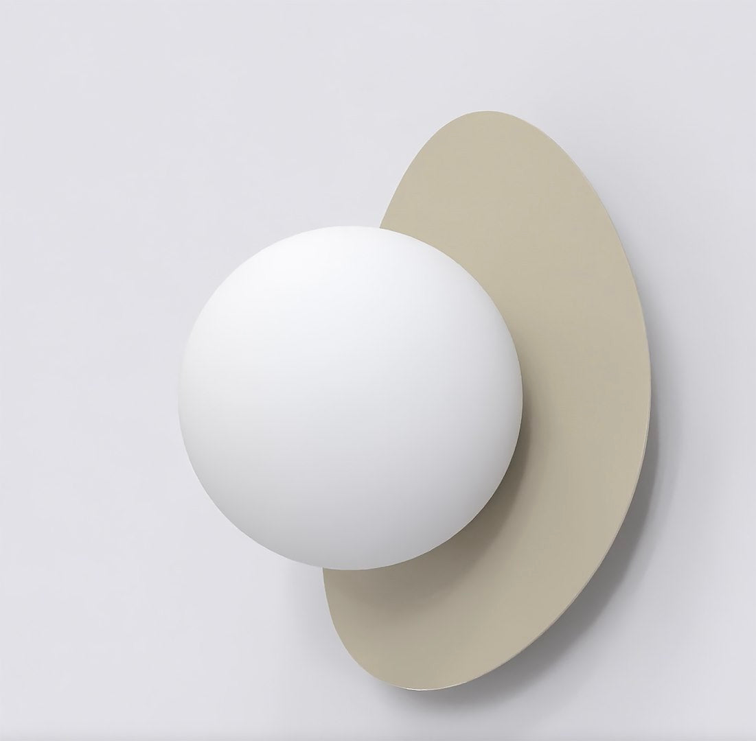 Profil montrant la sphère blanche en saillie devant la plaque beige