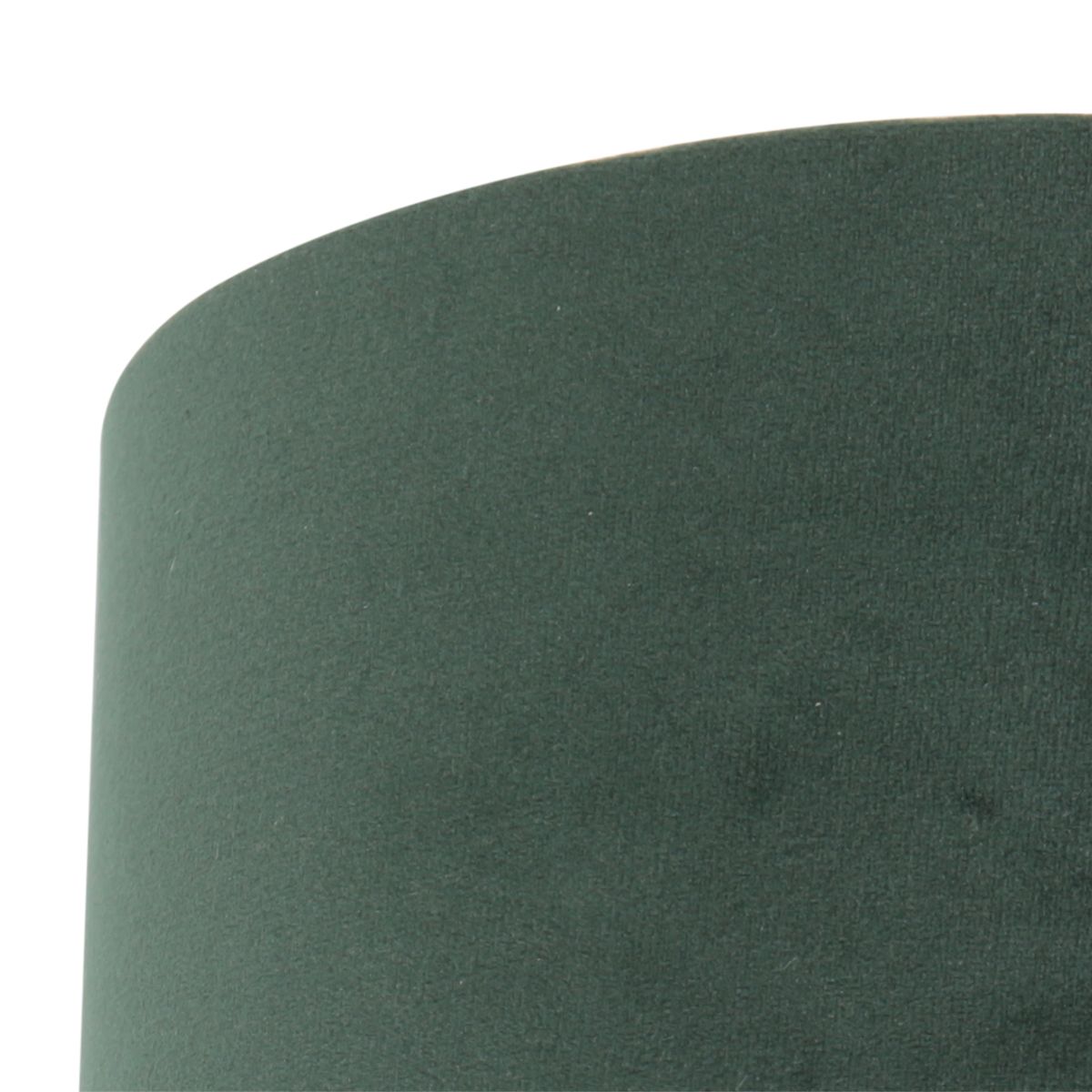 Détail rapproché du tissu velours vert et de sa couture latérale