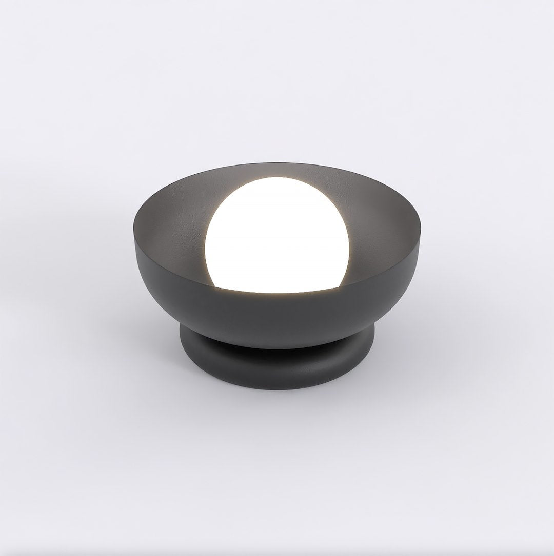 Vue en plongée montrant la sphère blanche à l'intérieur de la coupe