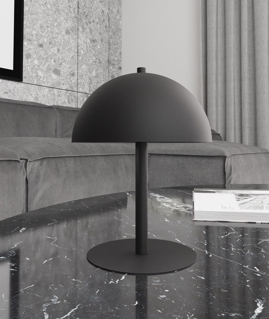 Lampe posée sur une table en marbre noir dans un salon aux tons gris.