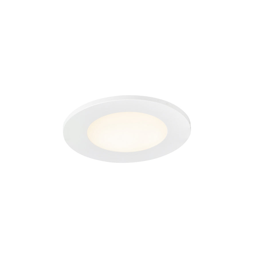 Spot encastrable blanc vu de trois quarts, collerette et halo lumineux visibles