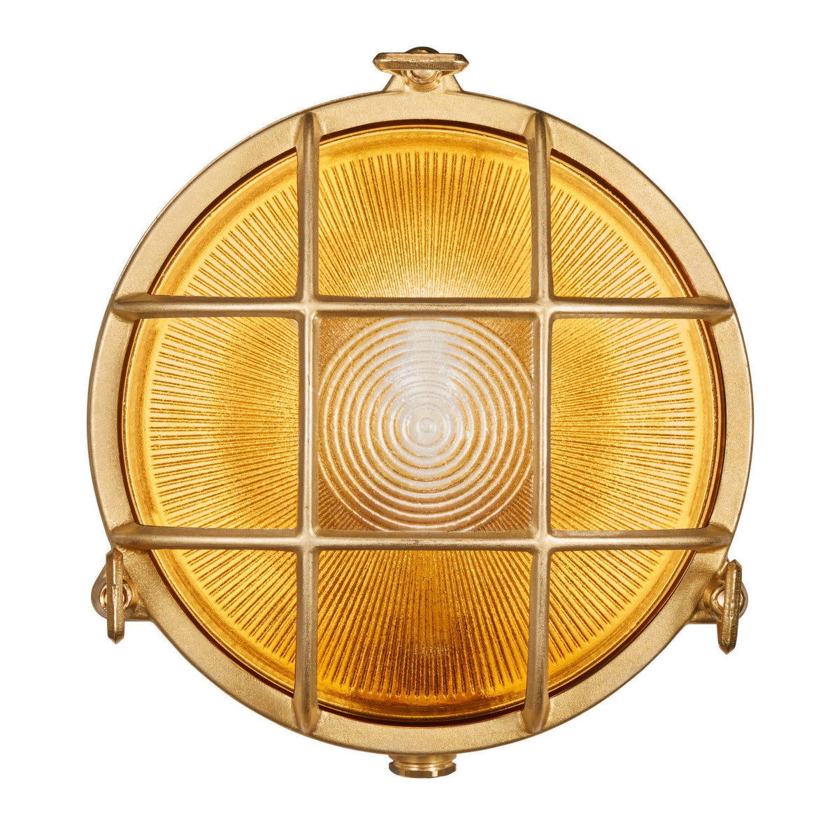 Vue de face du luminaire allumé, verre ambré texturé et croisillons de laiton