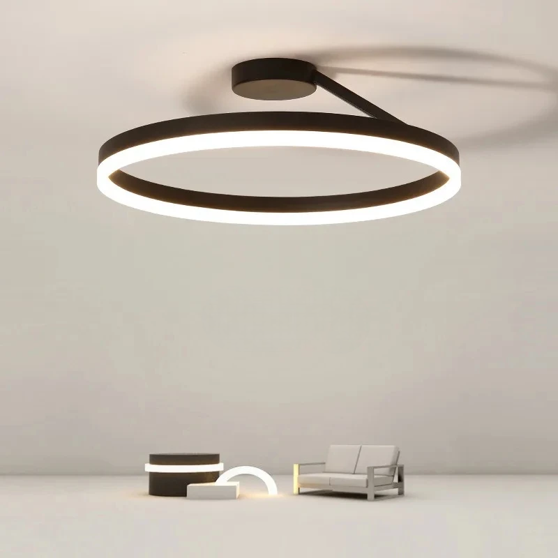Version noire du luminaire, mise en ambiance avec canapé et table basse minimalistes