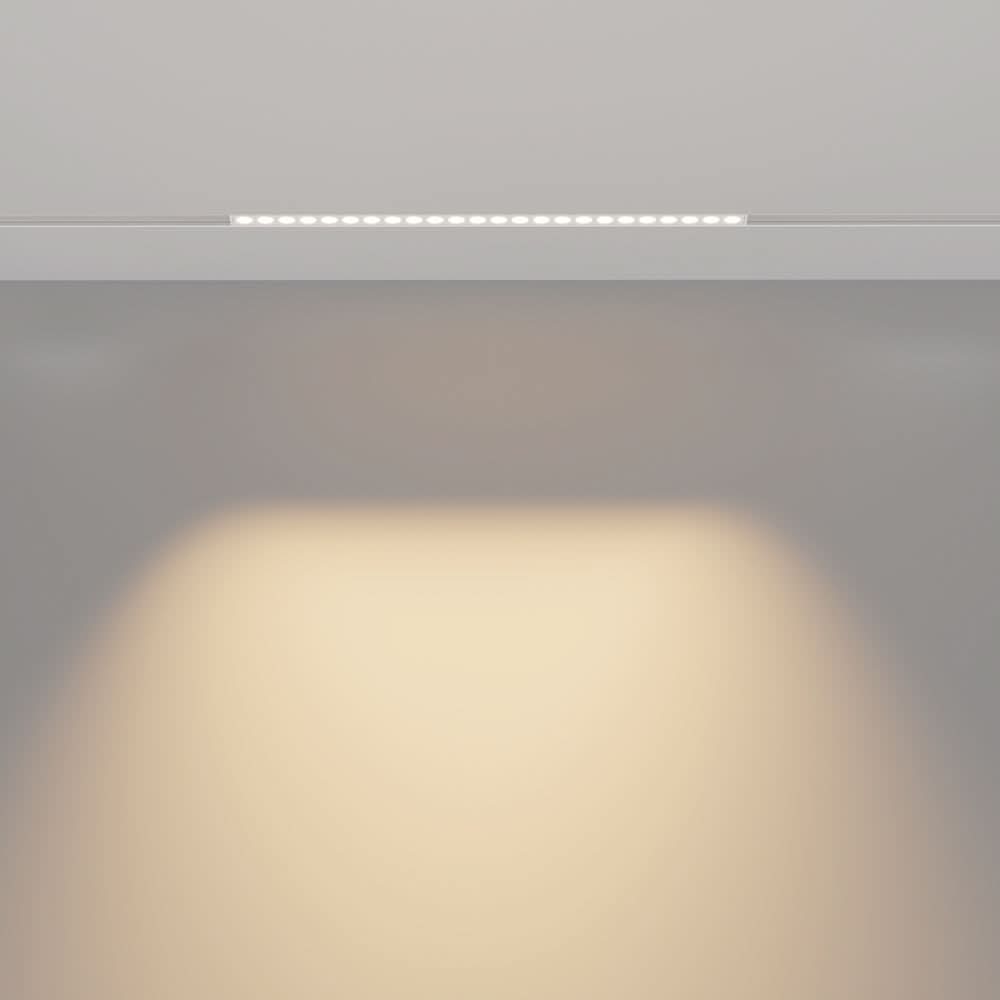 Mise en ambiance avec halo lumineux diffus projeté sous le rail encastré