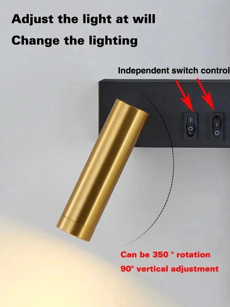 Détail du projecteur doré orientable et des deux interrupteurs indépendants encastrés.