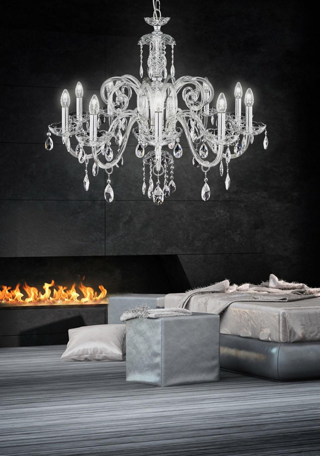 Lustre allumé devant un mur sombre, ambiance chambre moderne