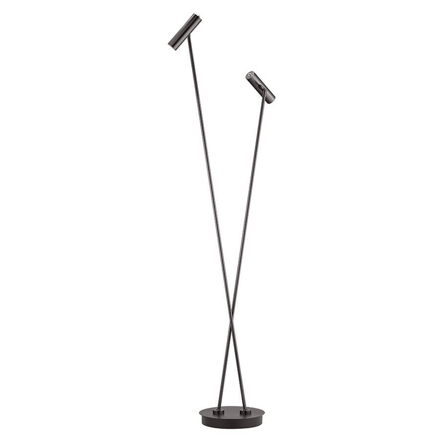 Lampadaire en métal foncé avec deux bras croisés et têtes cylindriques orientables, fond blanc