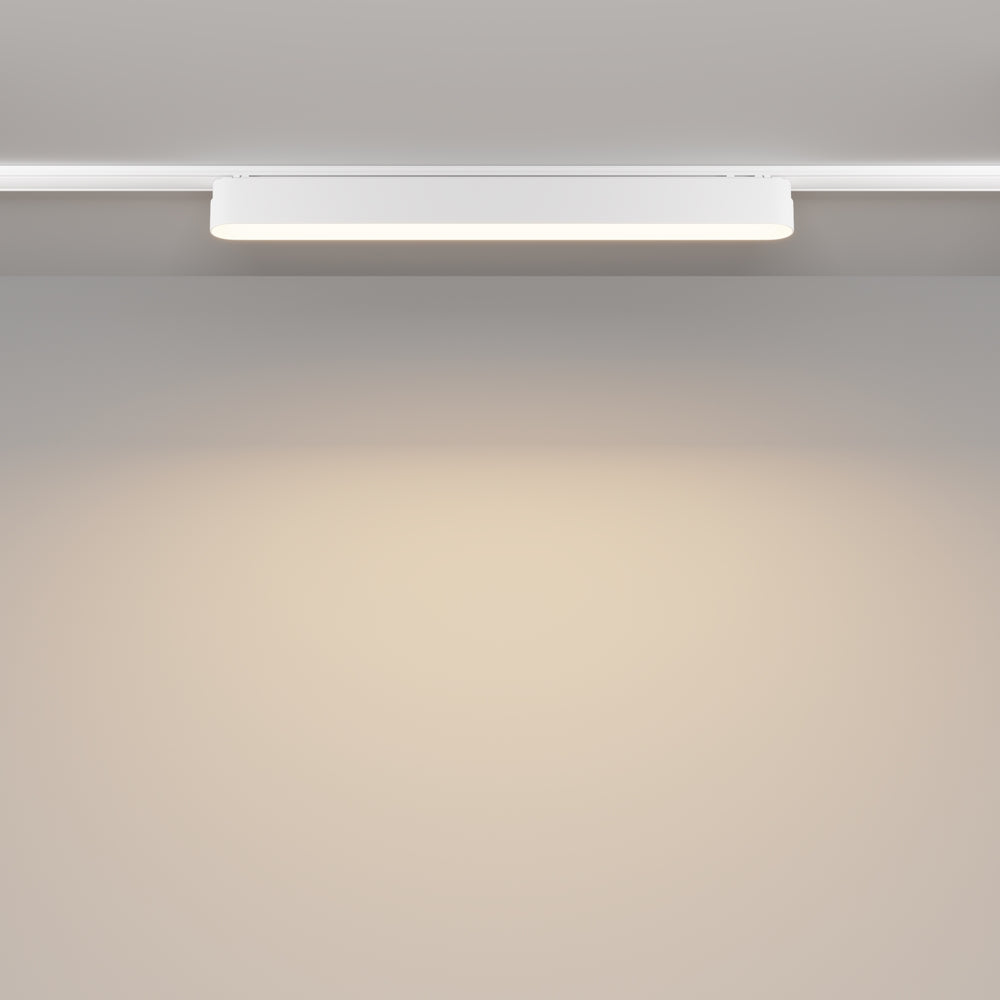 Mise en ambiance : halo de lumière chaude diffusé sur un mur neutre.