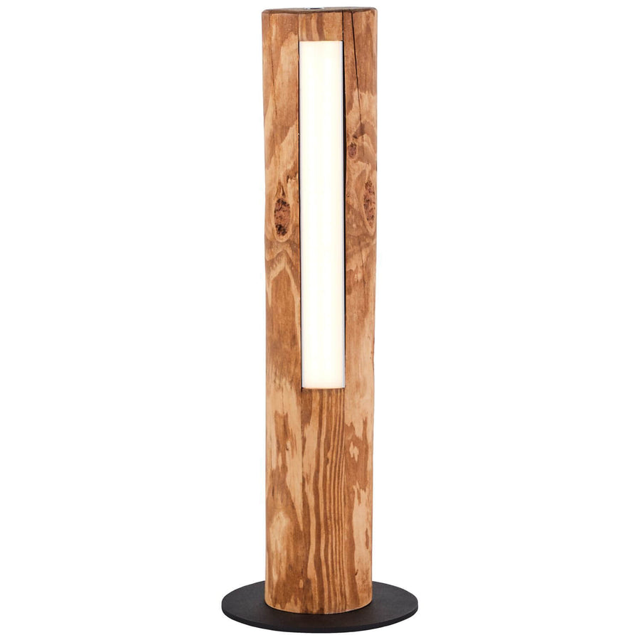 Lampe à poser en bois allumée, vue de face sur fond blanc, base noire.