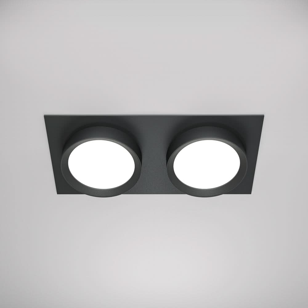 Version noire mate du luminaire double spot vue de dessous sur fond clair