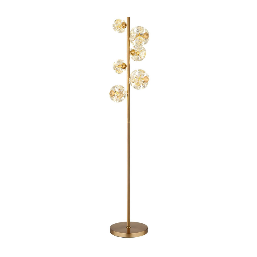 Lampadaire doré vertical sur fond blanc, mettant en valeur ses diffuseurs sphériques et sa base ronde.