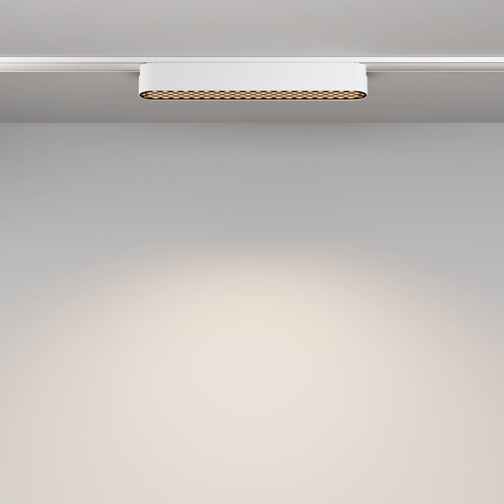 Mise en ambiance vue de dessous montrant le halo lumineux projeté sur le mur.