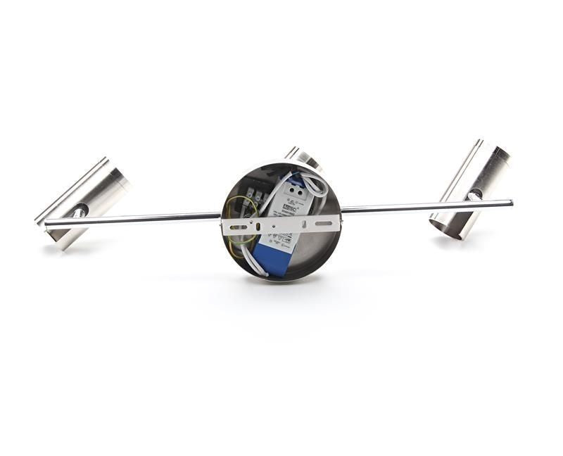 Détail du dessous du socle rond, boîtier électrique et fixations apparentes sur fond blanc.
