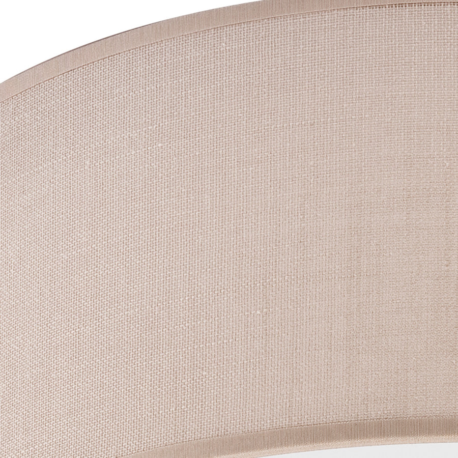Gros plan sur la texture tissée beige et la couture du plafonnier