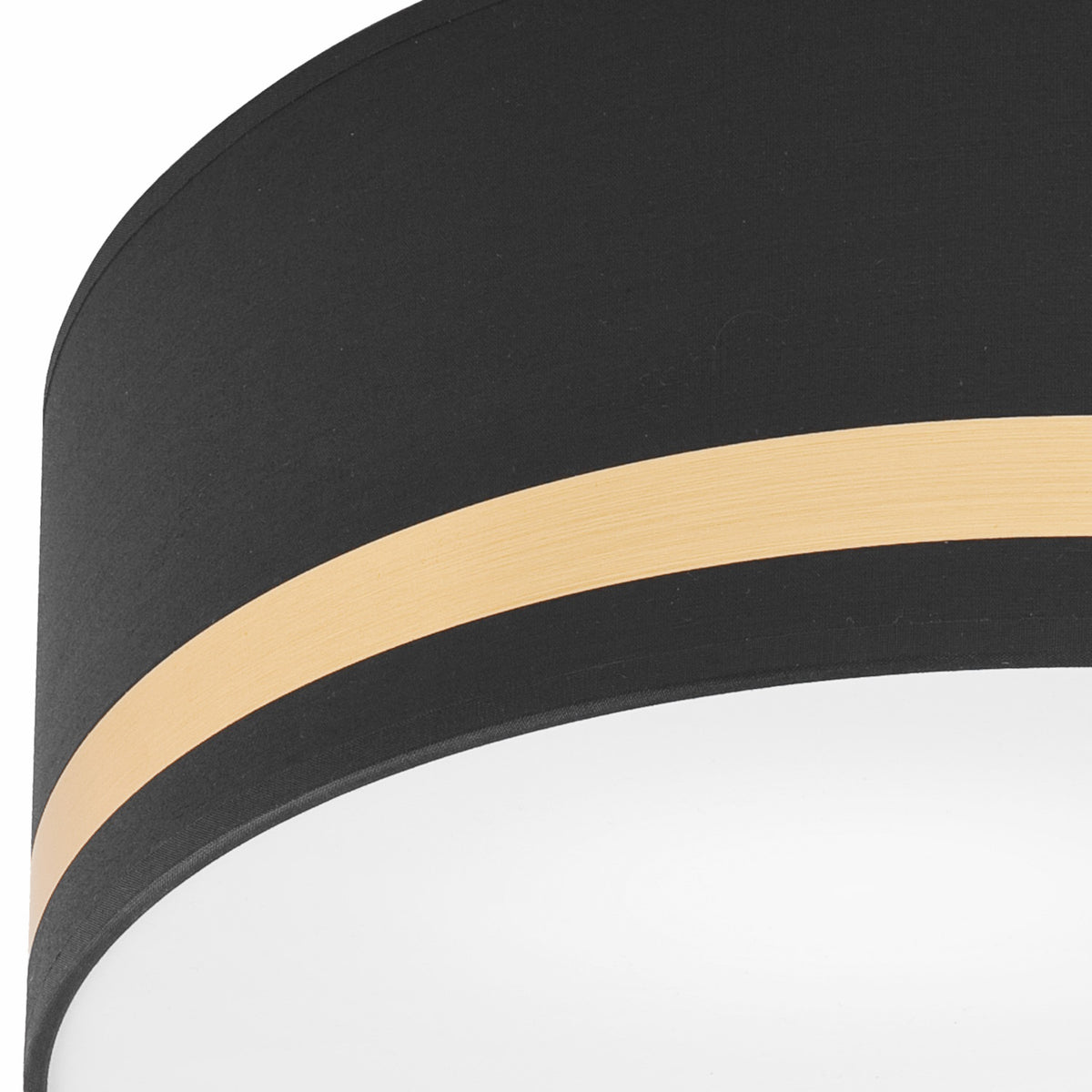 Détail de la finition noire et de la bande dorée texturée du luminaire.