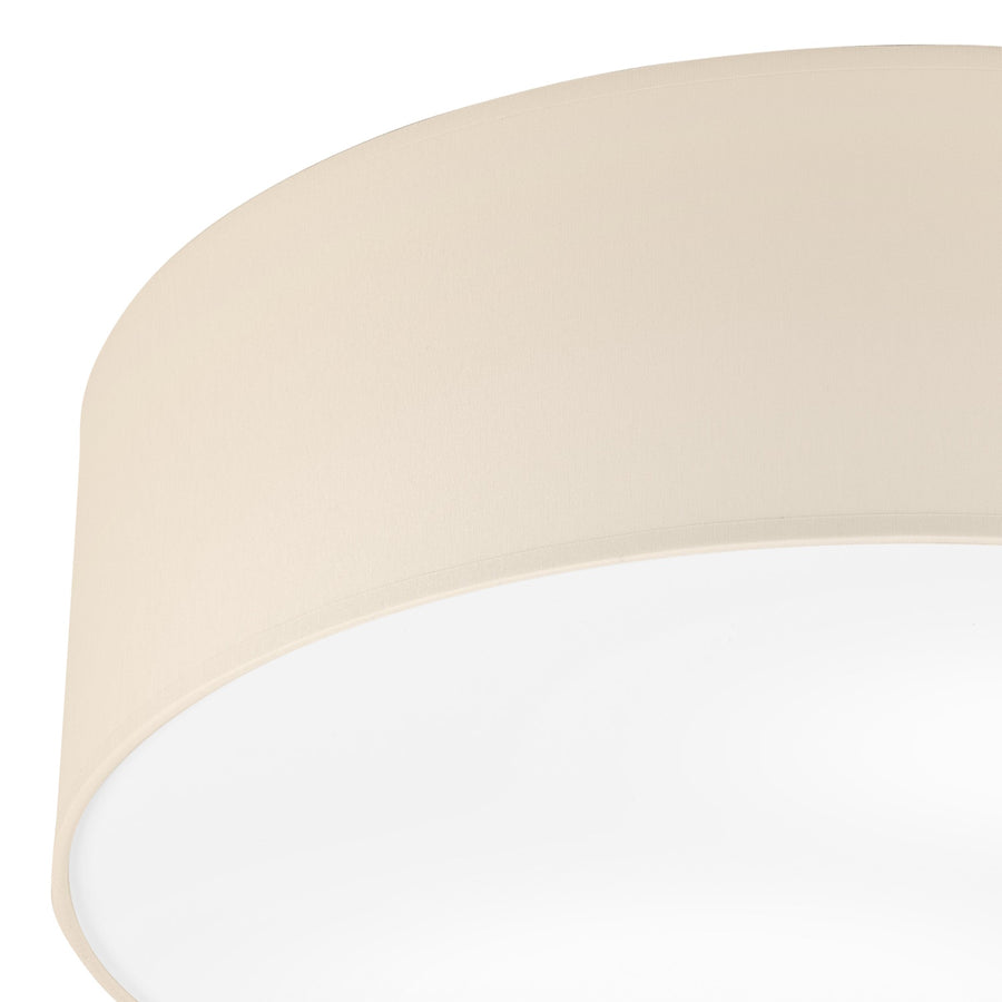 Détail de l'assise ronde, bord ourlé et diffuseur blanc laiteux.