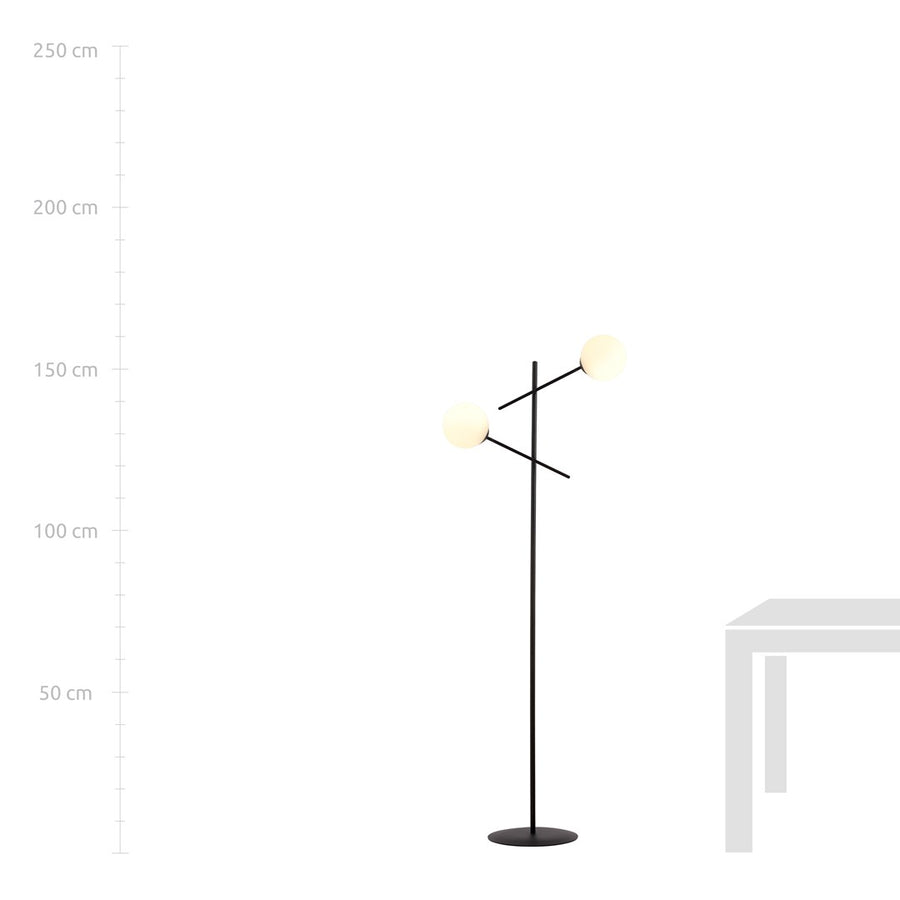 Mise en situation du lampadaire près d’une table, avec repères de hauteur.