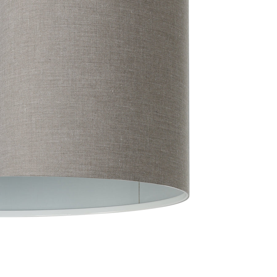 Détail gros plan de la texture en tissu gris et du diffuseur blanc inférieur.