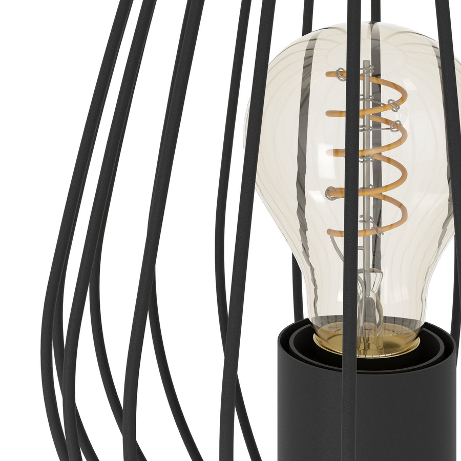 Détail rapproché de l'ampoule spirale dorée et des tiges noires