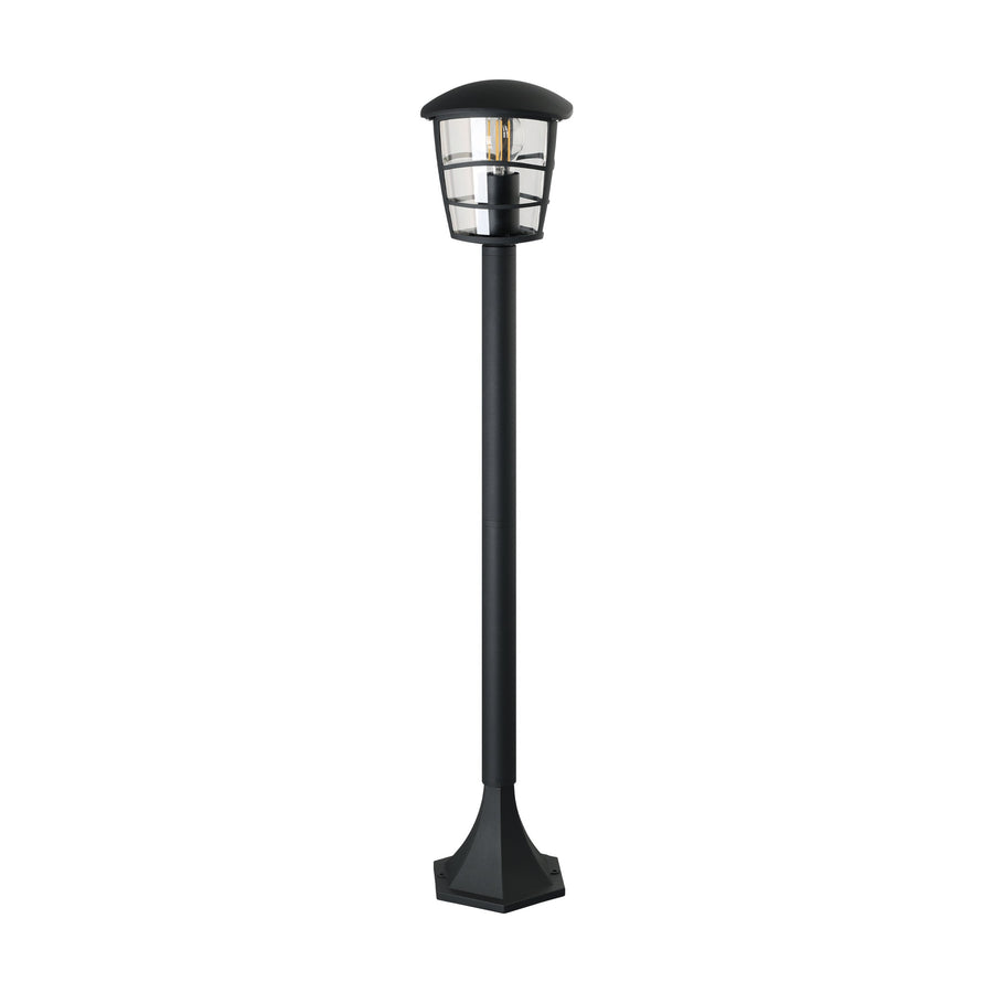 Vue de trois quarts du lampadaire noir avec son fût et sa large embase