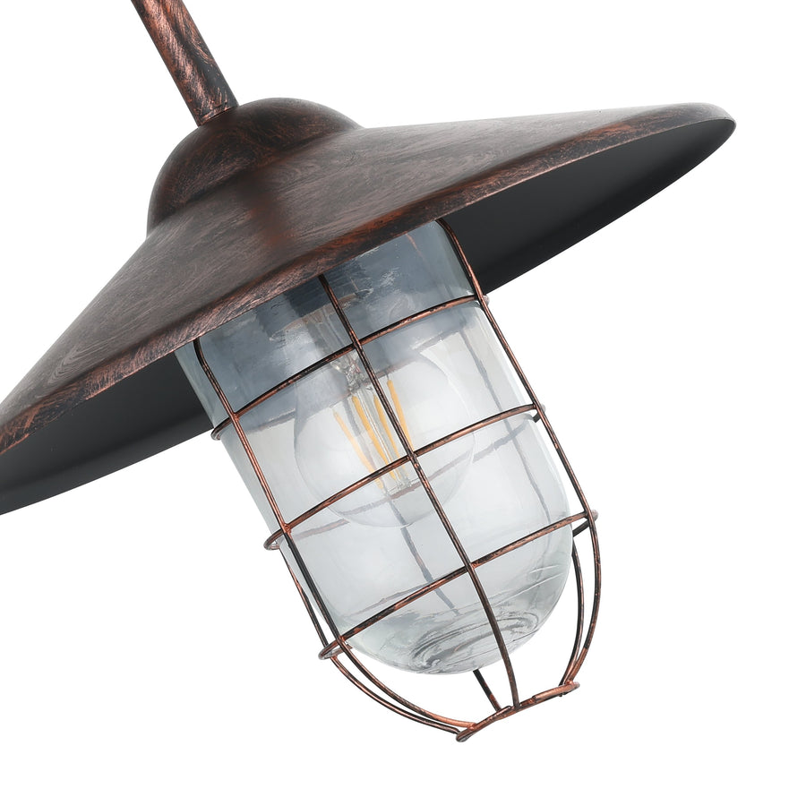 Gros plan sur le verre bombé et la grille métallique patinée