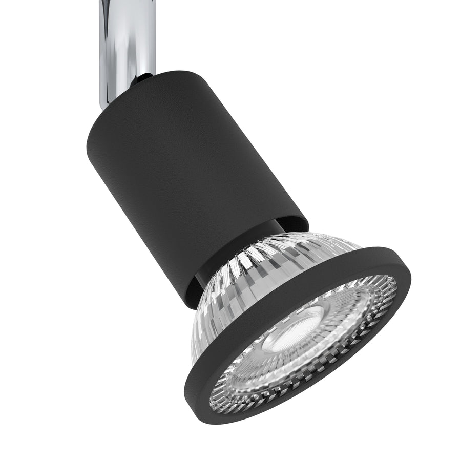 Gros plan sur la tête orientable noire et sa lentille en verre strié