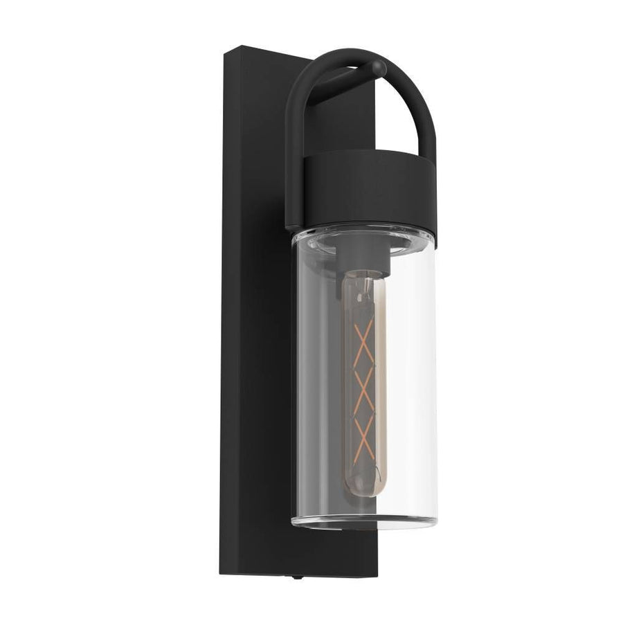 Applique murale noire vue de trois quarts, verre cylindrique transparent et ampoule filament