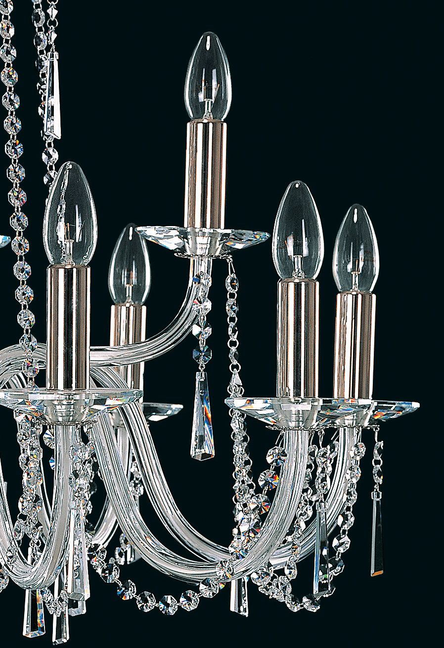 Détail des bras courbes en verre et des douilles gainées avec ampoules flammes.
