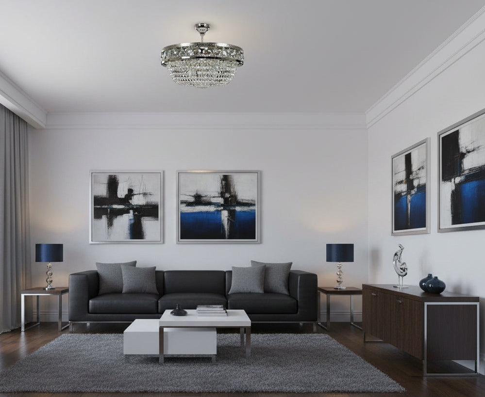 Plafonnier corbeille dans un salon contemporain blanc aux tableaux abstraits bleus