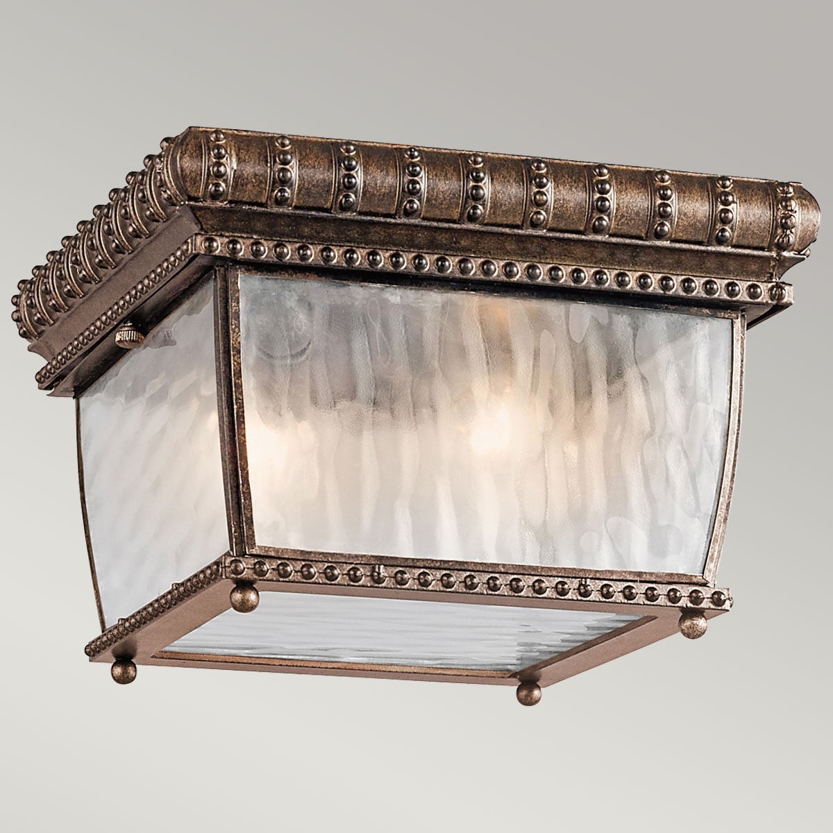 Vue de face du luminaire allumé, lumière chaude diffusée à travers le verre ondulé