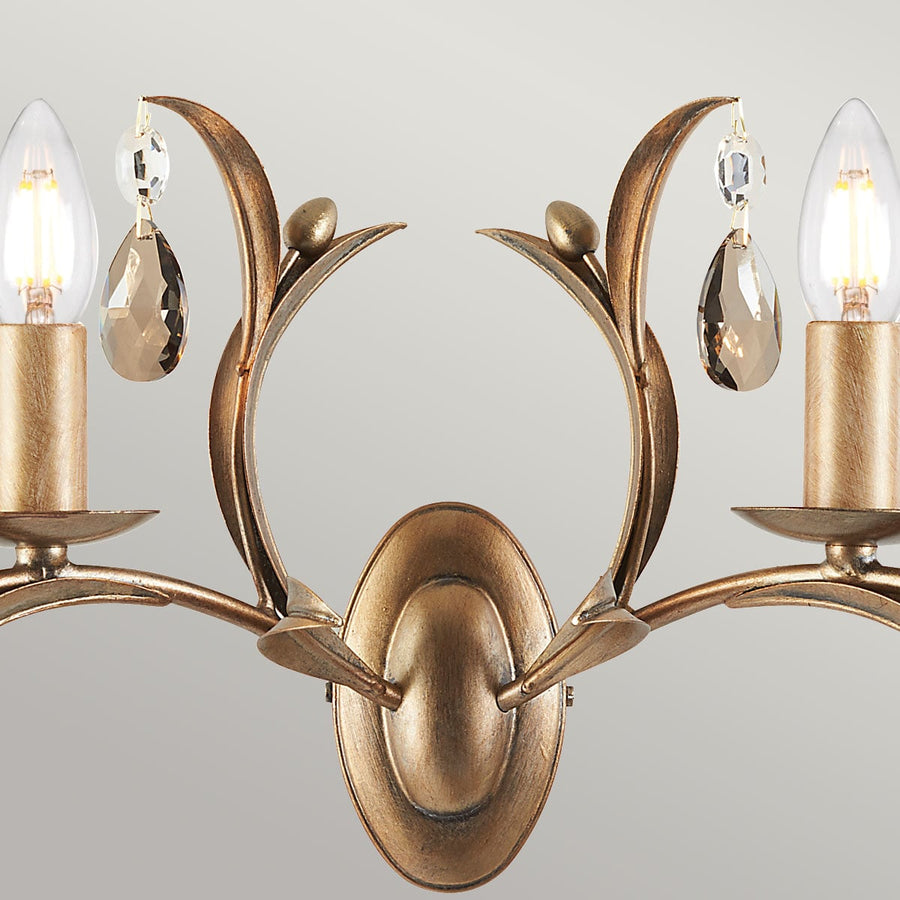 Détail du centre, platine ovale bronze et volutes en forme de feuilles opposées