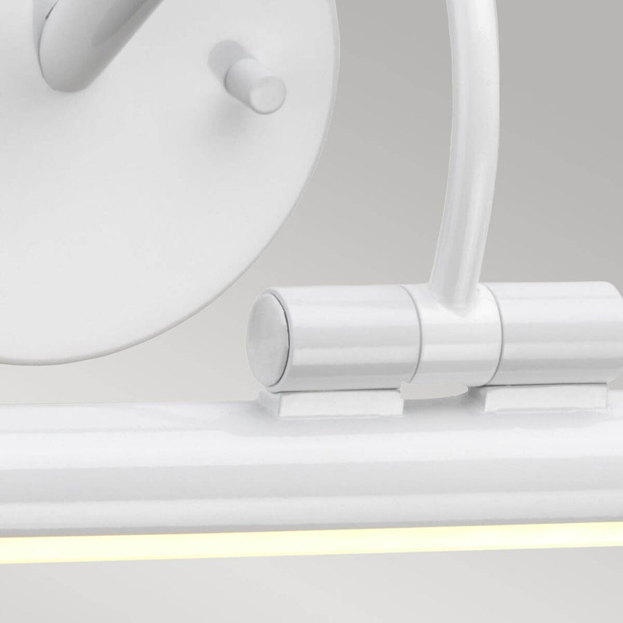 Gros plan du raccord entre le bras et le tube diffuseur allumé