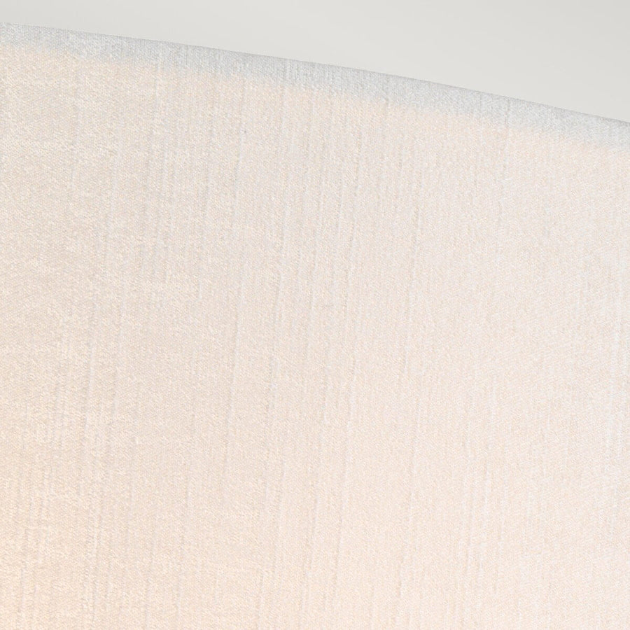 Détail rapproché du tissu crème texturé de l'abat-jour.