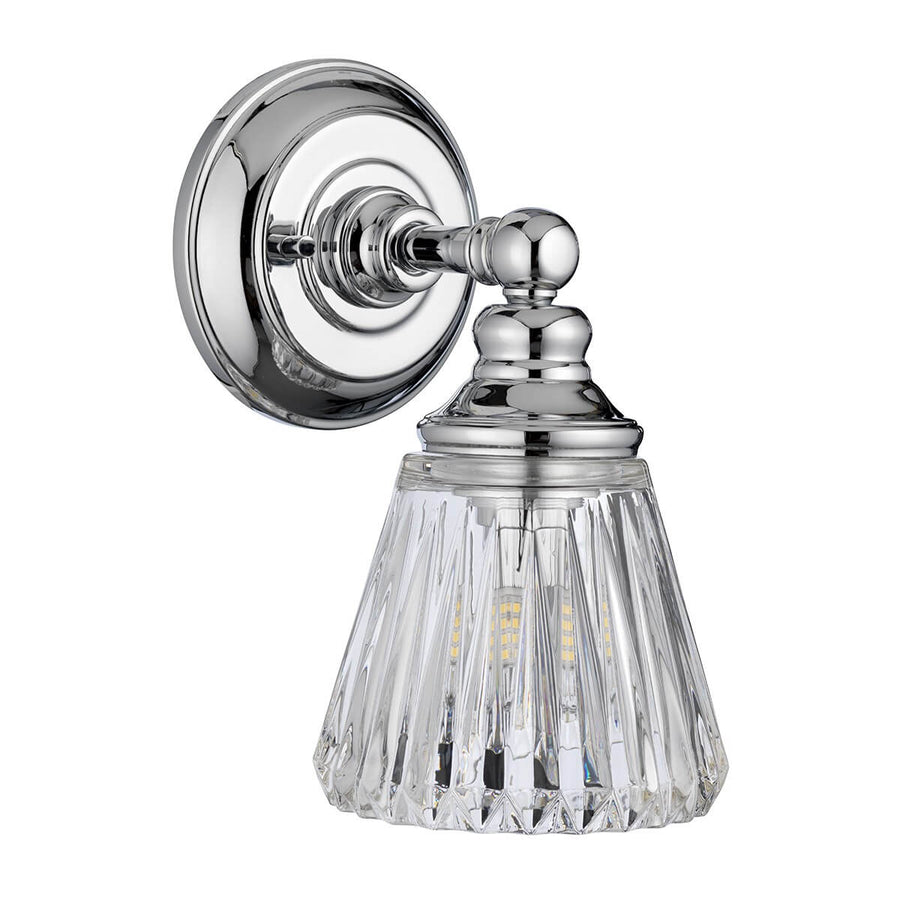 Autre angle du luminaire, ampoule allumée visible à travers le verre facetté