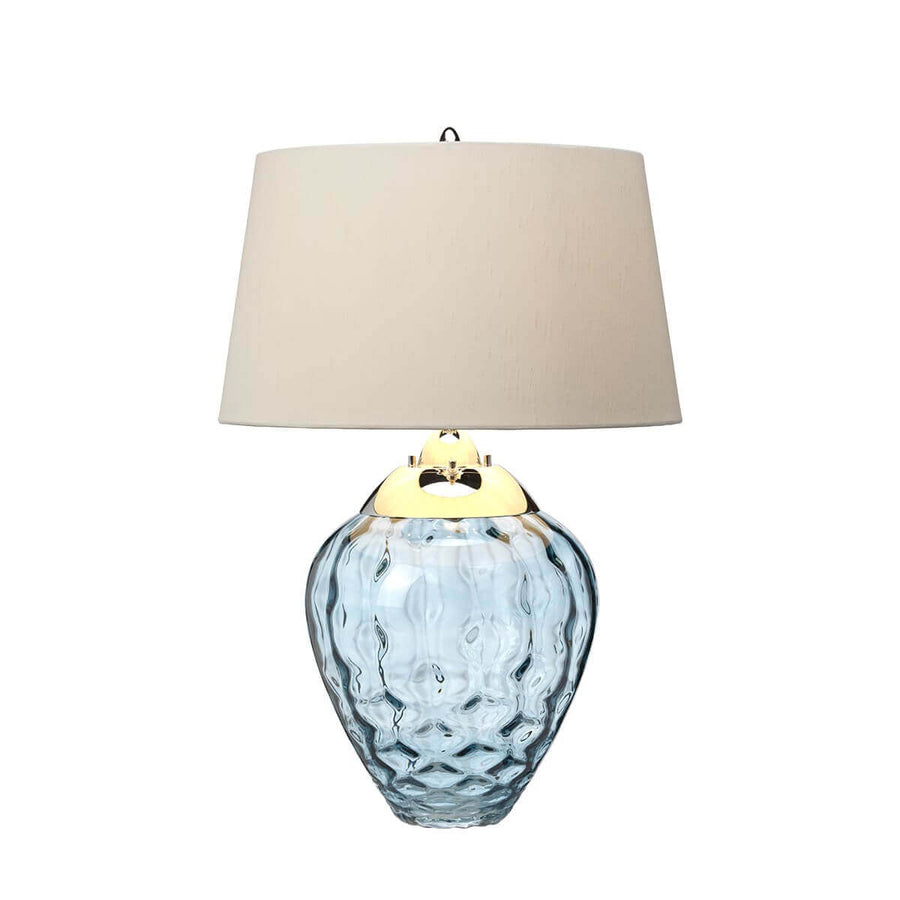 Même lampe avec finition métallique dorée et abat-jour en tissu clair