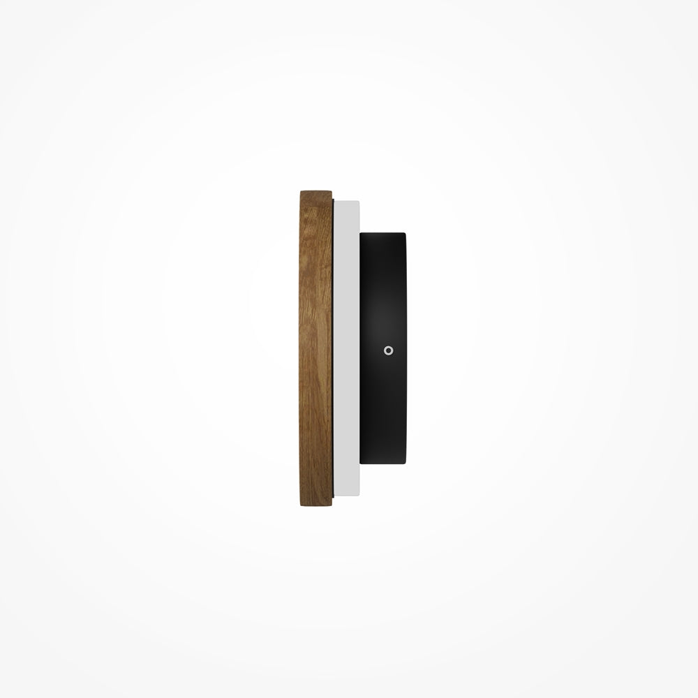 Vue latérale fine : épaisseur du disque bois, anneau blanc et fixation murale noire.